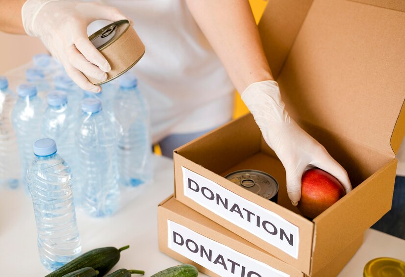 high-angle-boxes-with-provisions-food-day-donation_23-2148613287.jpg
